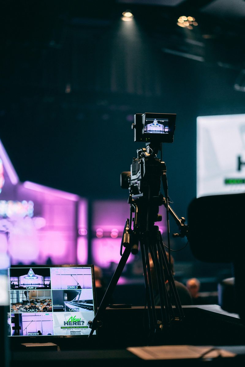 Broadcast camera on a tripod at a live event