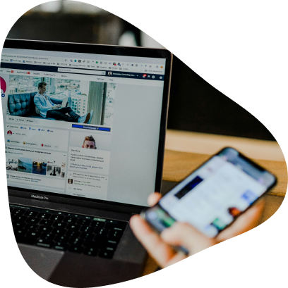 Laptop and phone open on a social feed